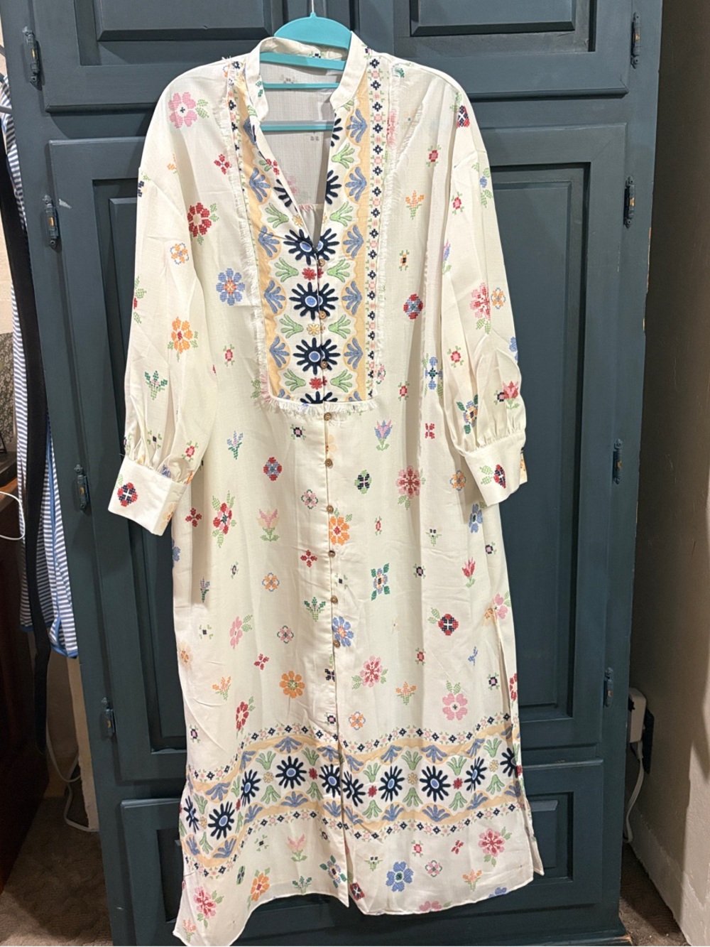 Lightweight Cream Floral Maxi Dress with Button Front and slit on both sides.